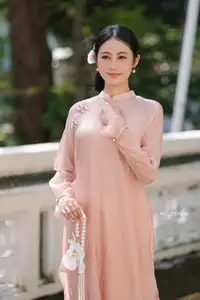 Timeless Beauty: Elegant Vietnamese Girl in Graceful Pink Ao Dai 1000024694-3
