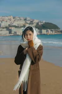 VGU No.81: Elegant Woman on a Winter Beach: A Pensive Moment of Style and Serenity.-3