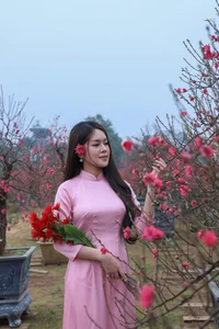 Hanoi Spring Vibes: Young Women in Traditional Ao Dai at Nhat Tan Peach Blossom Garden for Tet 2026-0