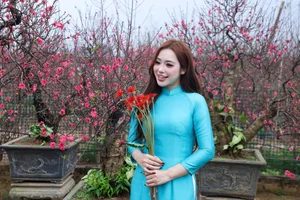 Hanoi Spring Vibes: Young Women in Traditional Ao Dai at Nhat Tan Peach Blossom Garden for Tet 2026-3