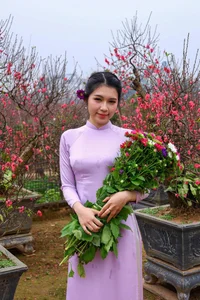 Hanoi Spring Vibes: Young Women in Traditional Ao Dai at Nhat Tan Peach Blossom Garden for Tet 2026-10