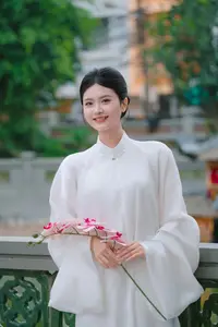 Pure Beauty: Girl in White with Orchids - Grace and Serenity of East Asian Charm-0