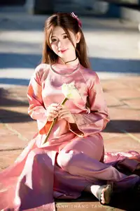 Captivating Serenity: Vietnamese Girl in Pink Ao Dai with Lotus Flowers1730591-33