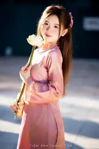 Captivating Serenity: Vietnamese Girl in Pink Ao Dai with Lotus Flowers1730591-10