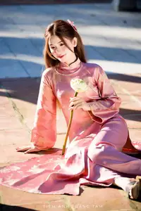 Captivating Serenity: Vietnamese Girl in Pink Ao Dai with Lotus Flowers1730591-23