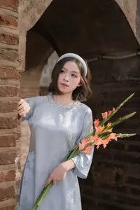 Serene Beauty: Vietnamese Young Woman by the Lake in Traditional Attire-5