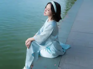 Serene Beauty: Vietnamese Young Woman by the Lake in Traditional Attire-0