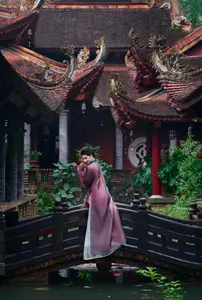 Graceful East Asian Beauty: Traditional Charm in a Lush Green Garden-13