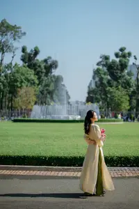 Serene Vietnamese Beauty in Ao Dai with Lilies: A Moment of Grace and Tranquility-1