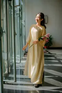 Serene Vietnamese Beauty in Ao Dai with Lilies: A Moment of Grace and Tranquility-7