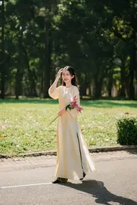 Serene Vietnamese Beauty in Ao Dai with Lilies: A Moment of Grace and Tranquility-3