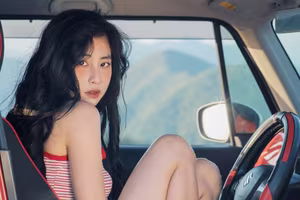 VGU No.128: Summer vibes: Young woman relaxed on a red car, captivating free spirit-1