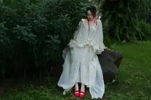 Elegant Woman in White Dress Amidst Lush Green Nature-6