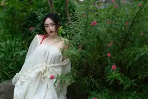 Elegant Woman in White Dress Amidst Lush Green Nature-14