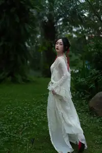 Elegant Woman in White Dress Amidst Lush Green Nature-15