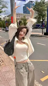 Vibrant Street Style: Young Woman Radiates Energy in Urban Chic Outfit-0