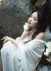 Serene Asian Beauty: A Delicate Moment with a White Flower-2