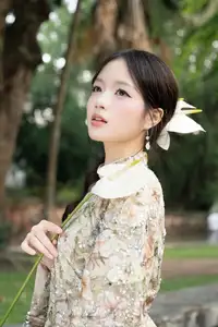East Asian Traditional Beauty: Gentle Young Woman in Ao Dai with Elegant Wooden Fan-16