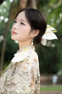 East Asian Traditional Beauty: Gentle Young Woman in Ao Dai with Elegant Wooden Fan-1
