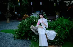 Graceful Vietnamese Woman in White Ao Dai with Lotus Flower in Serene Garden-0