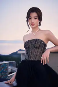 Rooftop Glamour: Elegant Woman Shines in Chic Black Dress, Captivating All Eyes with Effortless Style.-2