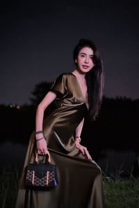 Enigmatic Beauty Under Full Moonlight: Woman in Elegant Silk Gown, A Dreamlike Night Moment.-1