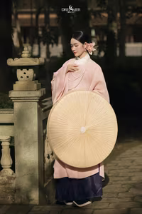 XVG No.50: Elegant Vietnamese Woman in Pink Traditional Dress, Conical Hat, Serene Beauty.-1