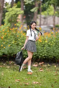 Gentle Schoolgirl's Innocent Beauty: Captivating School Style Amidst Vibrant Flowers-2