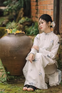 XVG No.29: Graceful Ao Dai - Unveiling the Serene Beauty of a Vietnamese Woman with Golden Blooms.-18