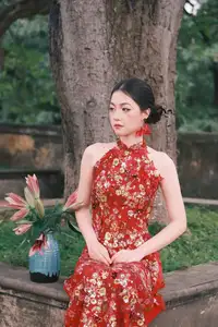 Graceful Asian Woman in Vibrant Red Floral Dress: Timeless Elegance by the Ancient Tree 1000024556-3
