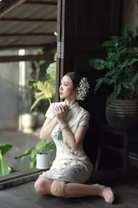 Timeless Grace: Vietnamese Woman in Modernized Ao Dai by a Serene Lotus Pond-1