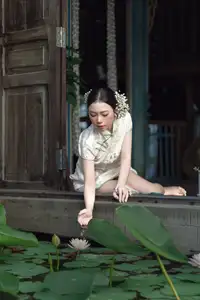 Timeless Grace: Vietnamese Woman in Modernized Ao Dai by a Serene Lotus Pond-11