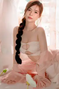 Ethereal Beauty: A Young Woman's Delicate Charm in a Flowing Pink Dress-8