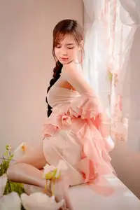 Ethereal Beauty: A Young Woman's Delicate Charm in a Flowing Pink Dress-22