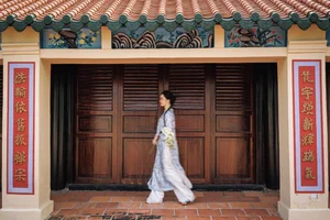 Timeless Grace in Blue Floral Ao Dai and Ancient Architecture-7