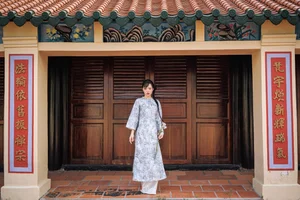 Timeless Grace in Blue Floral Ao Dai and Ancient Architecture-3