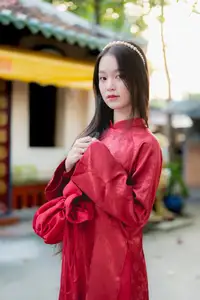 Elegant Vietnamese Beauty in Red Ao Dai: A Glimpse into Traditional Grace-0