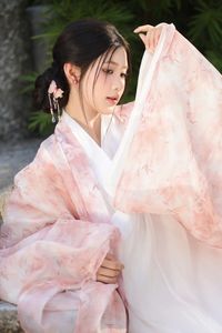 Explore East Asian Traditional Beauty: An Elegant Muse in Soft Pastel Attire.-3