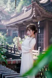 Graceful Vietnamese Girl in Traditional Attire by Ancient Architecture | Discover Asian Beauty and Cultural Charm-3