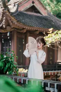 Graceful Vietnamese Girl in Traditional Attire by Ancient Architecture | Discover Asian Beauty and Cultural Charm-0