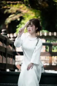 Graceful Vietnamese Girl in Traditional Attire by Ancient Architecture | Discover Asian Beauty and Cultural Charm-1