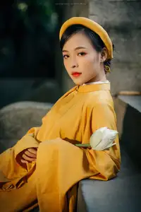 Discover the Graceful Beauty of a Vietnamese Woman in Radiant Yellow Ao Dai with Pure Lotus 1000025235-1