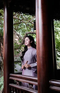Ethereal Grace in Lavender Ao Dai Amidst Ancient Architecture-1