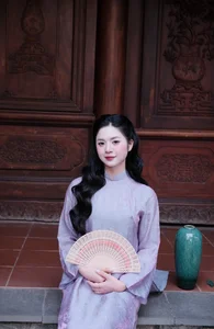 Ethereal Grace in Lavender Ao Dai Amidst Ancient Architecture-5