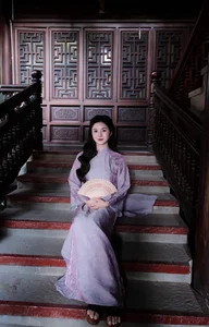 Ethereal Grace in Lavender Ao Dai Amidst Ancient Architecture-3