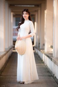 Graceful Vietnamese Girl in Pristine White Ao Dai: Timeless Beauty.-1