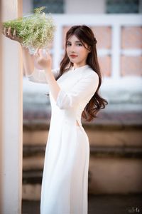 Graceful Vietnamese Girl in Pristine White Ao Dai: Timeless Beauty.-12