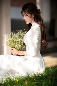Graceful Vietnamese Girl in Pristine White Ao Dai: Timeless Beauty.-13