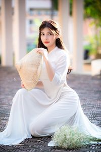 Graceful Vietnamese Girl in Pristine White Ao Dai: Timeless Beauty.-9