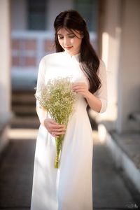 Graceful Vietnamese Girl in Pristine White Ao Dai: Timeless Beauty.-7